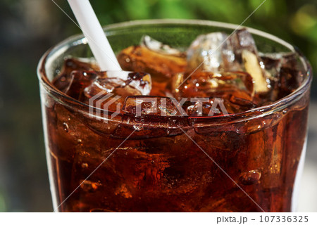 A glass of iced soda on the table A glass of iced soda on the table 107336325