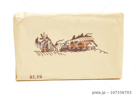 Stick of wrapped butter isolated on white background 107336703