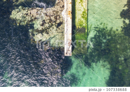 Aerial view of the north west pier on Cruit Island, Tobernoran, bay, County Donegal, Ireland 107338688