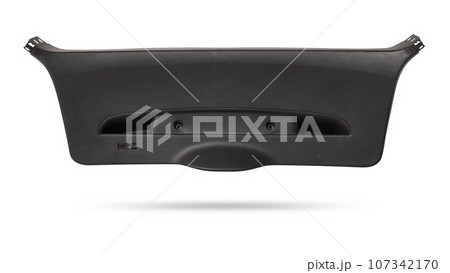 Sheathing of a car body part - trunk made of black plastic on a white isolated background in a photo studio for replacement or sale in a workshop. 107342170
