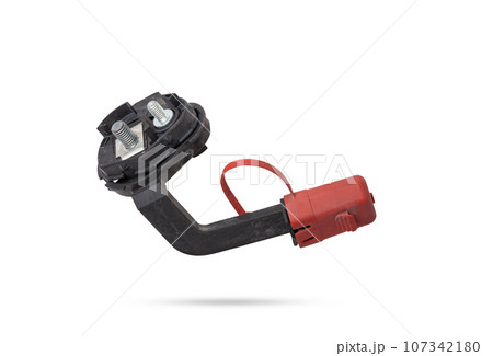 Close up view positive battery terminal and squib for disconnection in case of an accident. Vehicle security systems. 107342180