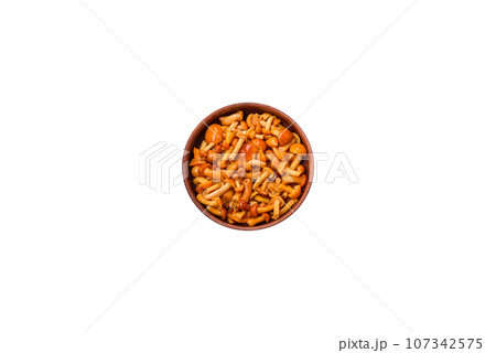 Delicious pickled honey mushrooms with salt and spices in a ceramic plate Delicious pickled honey mushrooms with salt and spices in a ceramic plate 107342575