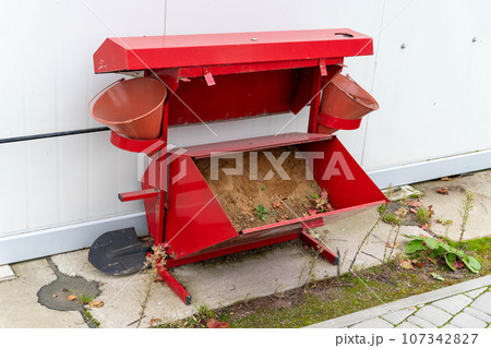 a street fire shield with sand to extinguish the fire, a shovel and buckets. a street fire shield with sand to extinguish the fire, a shovel and buckets. 107342827