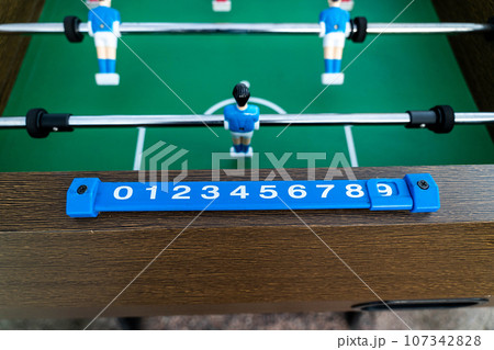 Close-up of figures of plastic players in a football match. Close-up of figures of plastic players in a football match. 107342828