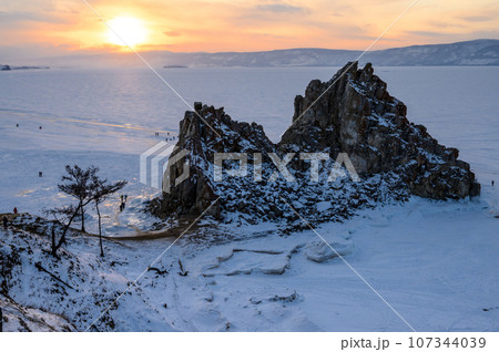 Shamanka Rock. sunset. Olkhon Island. snowy and frosty winter. Shamanka Rock. sunset. Olkhon Island. snowy and frosty winter. 107344039