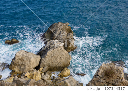 MELLIEHA, MALTA - 01 JAN, 2020: A close up of a rock near the ocean on the island of Malta MELLIEHA, MALTA - 01 JAN, 2020: A close up of a rock near the ocean on the island of Malta 107344517