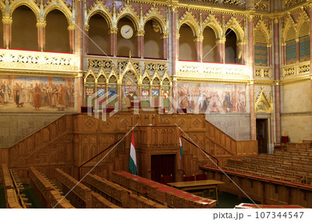 BUDAPEST, HUNGARY - 03 MAR 2019: Interior of the Budapest Parliament building and the meeting room of the Hungarian government with a lot of wood applications BUDAPEST, HUNGARY - 03 MAR 2019: Interior of the Budapest Parliament building and the meeting room of the Hungarian government with a lot of wood applications 107344547