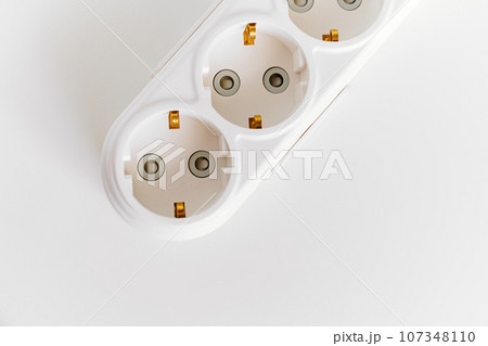 Socket pads for extension cords and surge protectors on a white background. 107348110