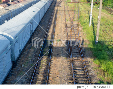 Railroad in the city. Many railway paths. Wagons and trains on the tracks. unloading station. Tank wagons. Railroad in the city. Many railway paths. Wagons and trains on the tracks. unloading station. Tank wagons. 107350811