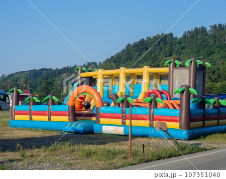 Inflatable island. Attraction for children. Rubber, inflatable trampoline for jumping. Inflatable island. Attraction for children. Rubber, inflatable trampoline for jumping. 107351040