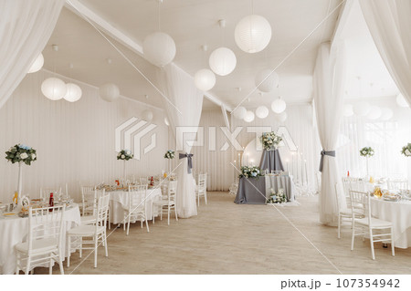 A view inside a marquee set up for a wedding reception A view inside a marquee set up for a wedding reception 107354942