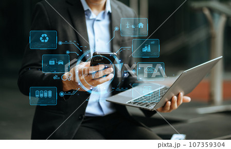 Businessman working virtual tablet computer twith reduce CO2 concept with icons, global warming such as reforest green factory recycle in office. 107359304