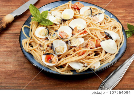 Pasta with fried clams vongole. Pasta with fried clams vongole. 107364094
