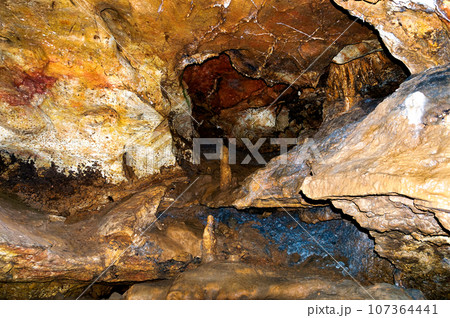 Stalactite, stalagmite walls of the cave. Template for design. 107364441