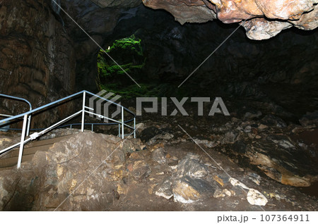 Crimea, Russia. Stalactites, stalagmites on the walls of the Emine-Bair-Khosar cave. Template for design. Selective sharpness. Crimea, Russia. Stalactites, stalagmites on the walls of the Emine-Bair-Khosar cave. Template for design. Selective sharpness. 107364911