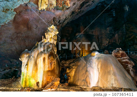 Crimea, Russia. Stalactites, stalagmites on the walls of the Emine-Bair-Khosar cave. Template for design. Selective sharpness. Crimea, Russia. Stalactites, stalagmites on the walls of the Emine-Bair-Khosar cave. Template for design. Selective sharpness. 107365411