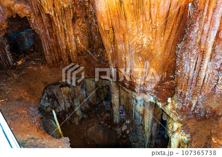 Crimea, Russia. Stalactites, stalagmites on the walls of the Emine-Bair-Khosar cave. Template for design. Selective sharpness. 107365738