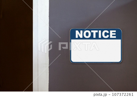 Blank notice sign on the side of an open door Blank notice sign on the side of an open door 107372261