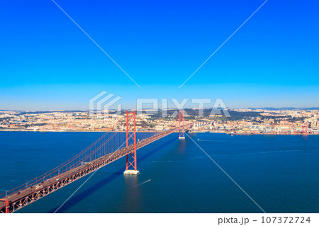 The 25th April Bridge (Ponte 25 de Abril) is a suspension bridge road-rail over the Tagus river that connects the city of Lisbon to the city of Almada. View from Almada. The 25th April Bridge (Ponte 25 de Abril) is a suspension bridge road-rail over the Tagus river that connects the city of Lisbon to the city of Almada. View from Almada. 107372724