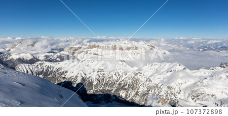Winter Italy Dolomite mountains covered with snow Winter Italy Dolomite mountains covered with snow 107372898