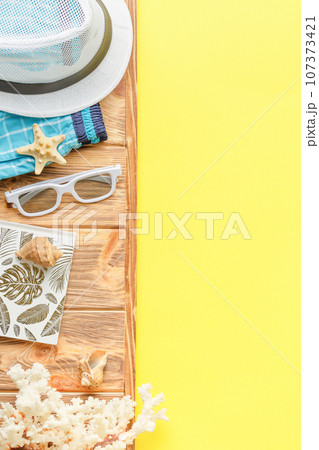 Beachwear and shellfish souvenirs. Flat lay. Beachwear and shellfish souvenirs. Flat lay. 107373421