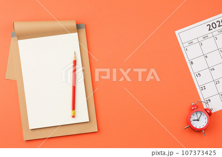 Top view office desk with calendar. 107373425