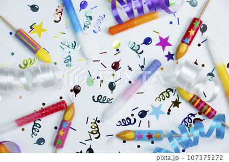 blue background with candies, balloons and tubes for birthday or party celebration,concept for birthday,anniversary,congratulations.  107375272