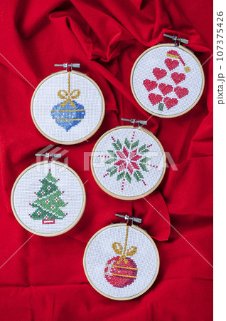 Handmade cross-stitch Christmas decoration 107375426