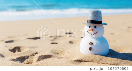 A cute snowman on the beach in bright sunlight, with the sea or ocean in the background. Merry Christmas time, greeting Card. Beach Christmas Vacation without Snow A cute snowman on the beach in bright sunlight, with the sea or ocean in the background. Merry Christmas time, greeting Card. Beach Christmas Vacation without Snow 107379602