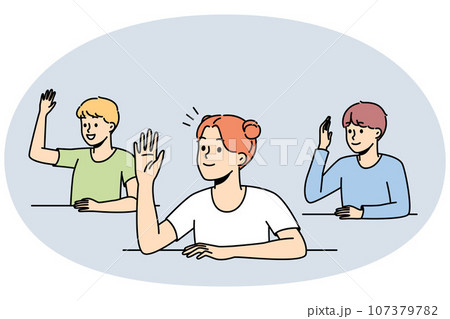Smiling children raise hands in classroom 107379782