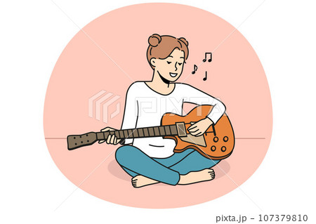 Smiling girl playing guitar 107379810