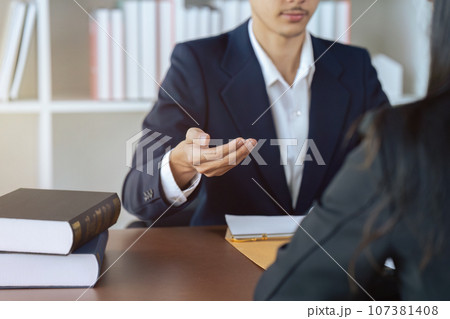 Businessman and lawyer or judge consult having team meeting with client 107381408