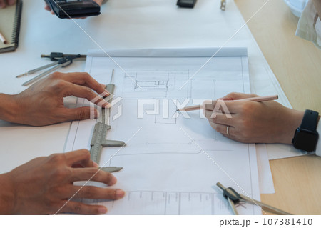 Group of engineer is discussion and brainstorming about condominium model of construction project Group of engineer is discussion and brainstorming about condominium model of construction project 107381410