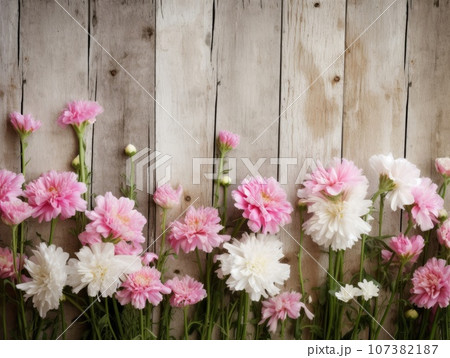 Top view of pink and white flowers against a wooden table background, in the style of vintage. Generative AI Top view of pink and white flowers against a wooden table background, in the style of vintage. Generative AI 107382187