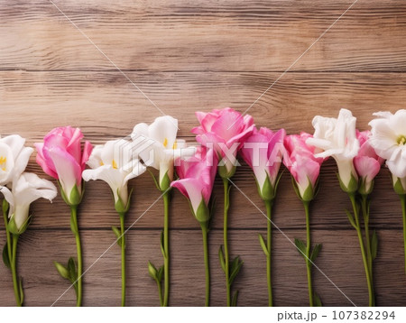 Top view of pink and white flowers against a wooden table background, in the style of vintage. Generative AI 107382294
