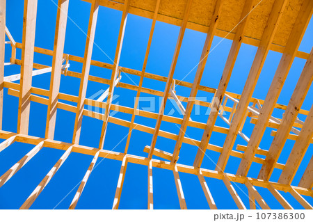 New house frame truss wooden roof beams support 107386300