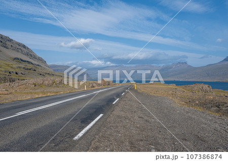 View of Berufjordur fjord and surrounding mountains from Ring Road, Iceland. View of Berufjordur fjord and surrounding mountains from Ring Road, Iceland. 107386874