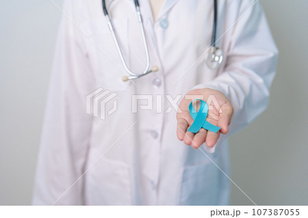 Blue November Prostate Cancer Awareness month, Doctor with Blue Ribbon in hospital for support people life and illness. Healthcare, International men, Father, Diabetes and World cancer day 107387055