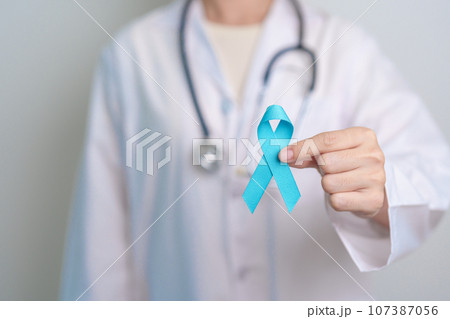 Blue November Prostate Cancer Awareness month, Doctor with Blue Ribbon in hospital for support people life and illness. Healthcare, International men, Father, Diabetes and World cancer day 107387056