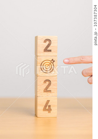 2024 year block with dartboard icon. Goal, Target, Resolution, strategy, plan, Action, mission, motivation, and New Year start concepts 107387304