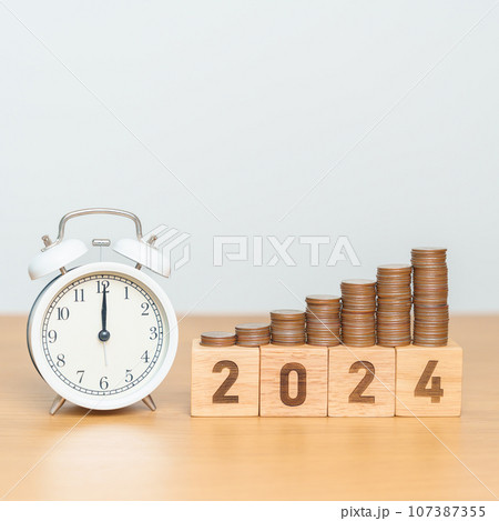 Happy New Year with vintage alarm clock and flipping 2023 change to 2024 block. Resolution, Goals, Plan, Action, Money Saving, Retirement fund, Pension, Investment and Financial concept Happy New Year with vintage alarm clock and flipping 2023 change to 2024 block. Resolution, Goals, Plan, Action, Money Saving, Retirement fund, Pension, Investment and Financial concept 107387355