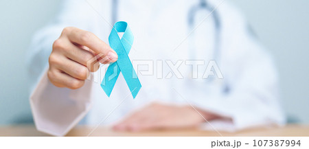 Blue November Prostate Cancer Awareness month, Doctor with Blue Ribbon in hospital for support people life and illness. Healthcare, International men, Father, Diabetes and World cancer day 107387994