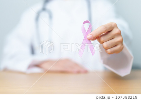 Doctor holding Purple Ribbon for Stomach, Violence, Pancreatic, Esophageal, Testicular cancer, Alzheimer, epilepsy, lupus, Sarcoidosis and Fibromyalgia. Awareness month and World cancer day concept Doctor holding Purple Ribbon for Stomach, Violence, Pancreatic, Esophageal, Testicular cancer, Alzheimer, epilepsy, lupus, Sarcoidosis and Fibromyalgia. Awareness month and World cancer day concept 107388219