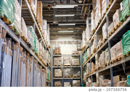 warehouse interior with shelves, pallets and boxes. storage department interior. 107388756