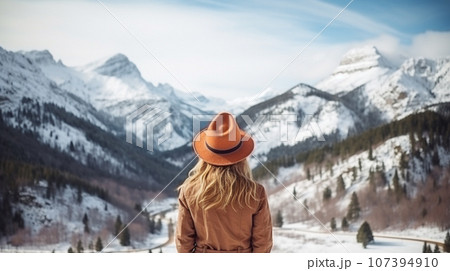 Traveler in winter trekking in the mountains Traveler in winter trekking in the mountains 107394910