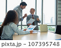 Business man and woman work together, celebrate success in start up office. Creative team brainstorm meeting, businesspeople colleague partnership concept 107395748