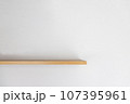 Empty wooden wall shelf on white background. 107395961