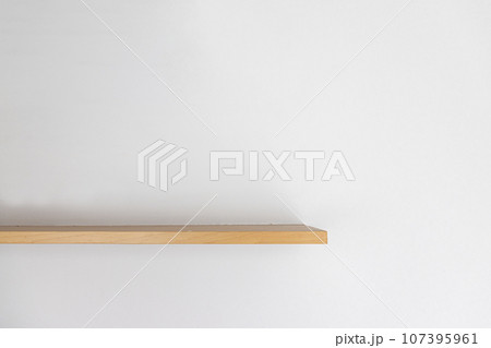 Empty wooden wall shelf on white background. Empty wooden wall shelf on white background. 107395961