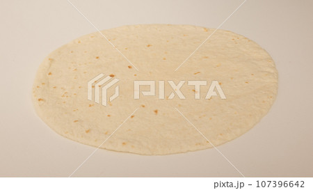 Corn tortillas on white background. Unleavened bread Corn tortillas on white background. Unleavened bread 107396642