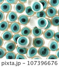 Texture of randomly scattered gelatin candies made in the form of blue eyes. 107396676